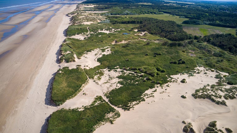View of the Formby landscape from a drone showing the sea, beach and dunes